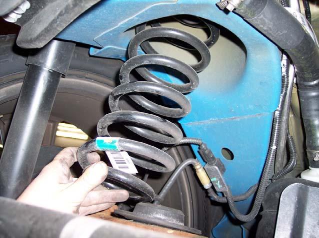 3. After bolt is removed, fully jack up the slightly lifted side until the