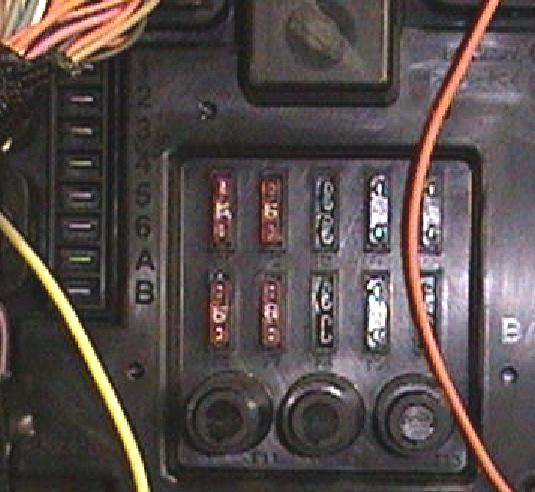 Using the red wire provided in the kit, connect it to the other side of the switch. (See Photo 10) 14. Make power connections to the fuse panel.