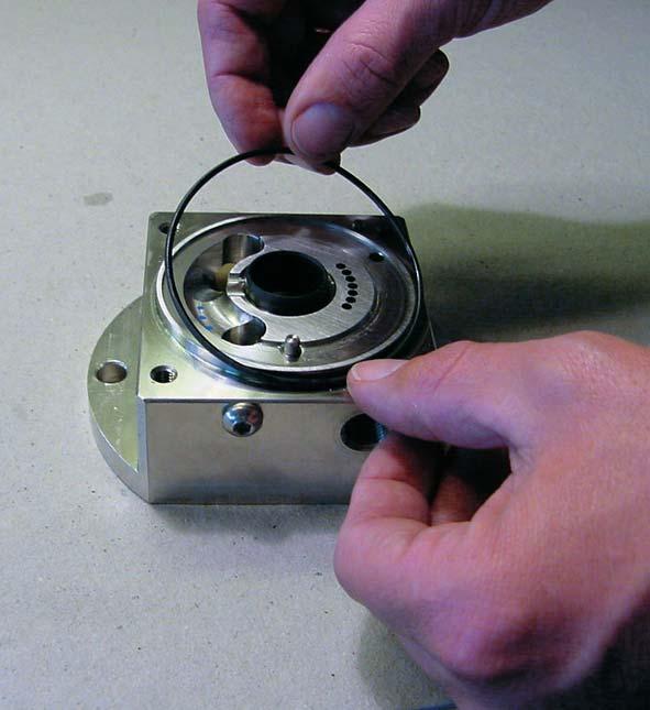 Mount the thrust plate with seals on the