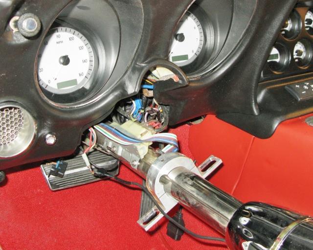 25. Remove the electrical (ignition switch) switch connection from the lower part of the steering column. There are 2 halves to this connector however they will come out as one.