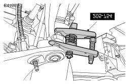 CAUTION: To prevent the wheel knuckle falling outwards and disconnection of the halfshaft inner joint, support the wheel knuckle. Loosen the upper arm retaining nut. 9.