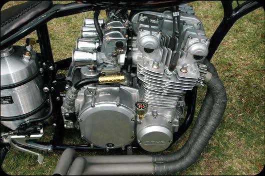 Photo of an old air-cooled four-cylinder engine where the engine and transmission are housed in one single aluminum case.