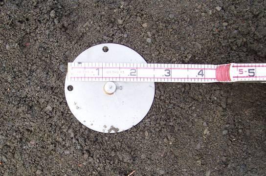 Initially, a hole was made in the soil to an appropriate depth so that following installation, the top of the strain gage would have adequate soil coverage for compaction to be performed safely.
