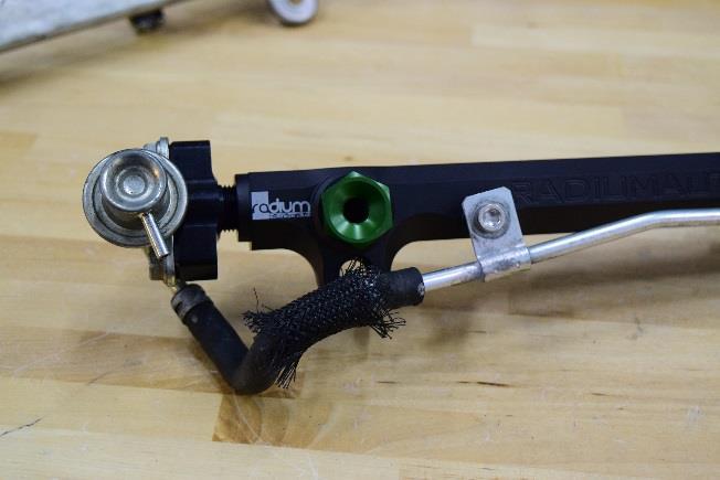 14. If using the 20-0112-00 Fuel Rail Kit, Evolution X, OEM Configuration, install the -6AN adapter into the inlet port of the fuel rail, as shown.