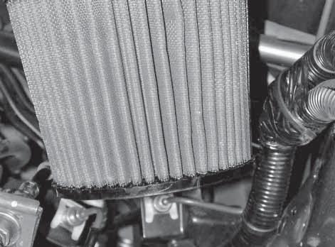 Ensure the air filter does not make contact with any part of the vehicle.