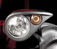 The lighting equipment, integrated into the mudguards, is comprised of reflecting parabolic optical