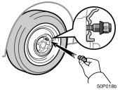 Reinstalling wheel nuts Lowering your vehicle 50p018b CAUTION Never use oil or grease on the bolts or nuts. Doing so may lead to overtightening the nuts and damaging the bolts.