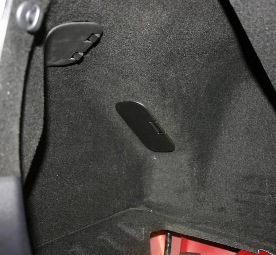The manual override pull for the fuel door is not visible although it is accessible from inside the trunk.