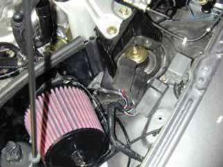 p. Align the heat shield over the hole on the power steering bracket.