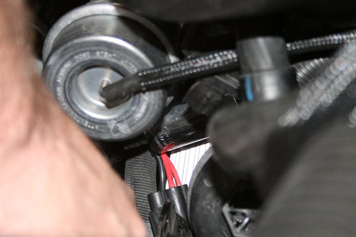 7. Once the coolant expansion tank and tubes connected to it are empty, go ahead and remove the tank itself by removing the 2 bolts and disconnecting all tubing. 8.