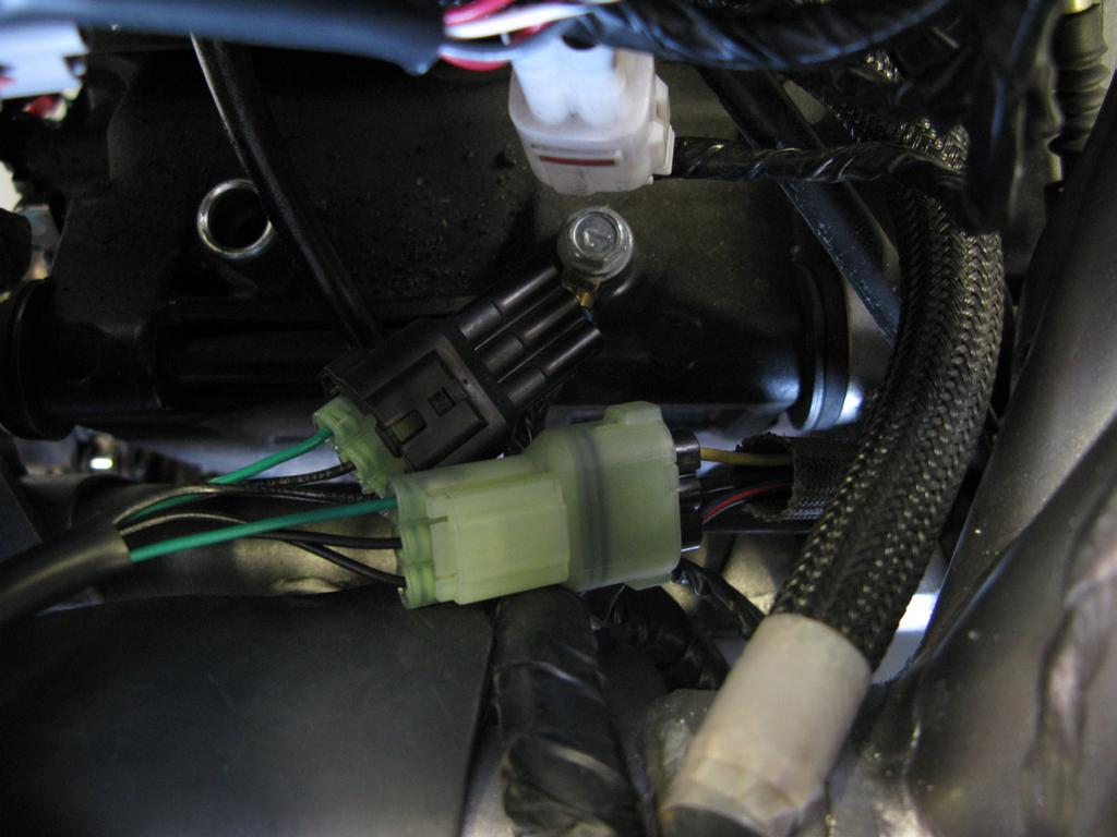6. Locate the black factory CKPS sensor s, on the right side of the engine compartment,