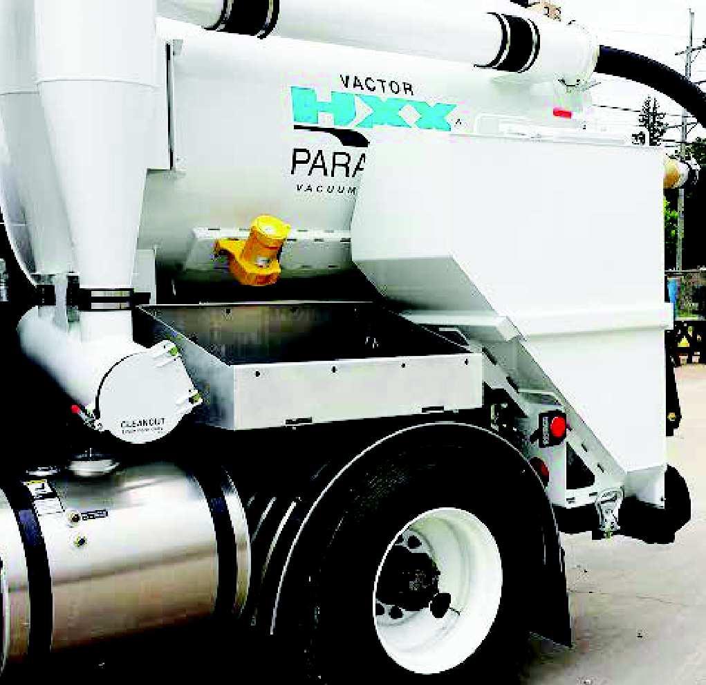 The hopper includes a vibrator to assist in material removal. The hopper can be filled via vacuum through a 4 loading port or manually through a top access hatch.