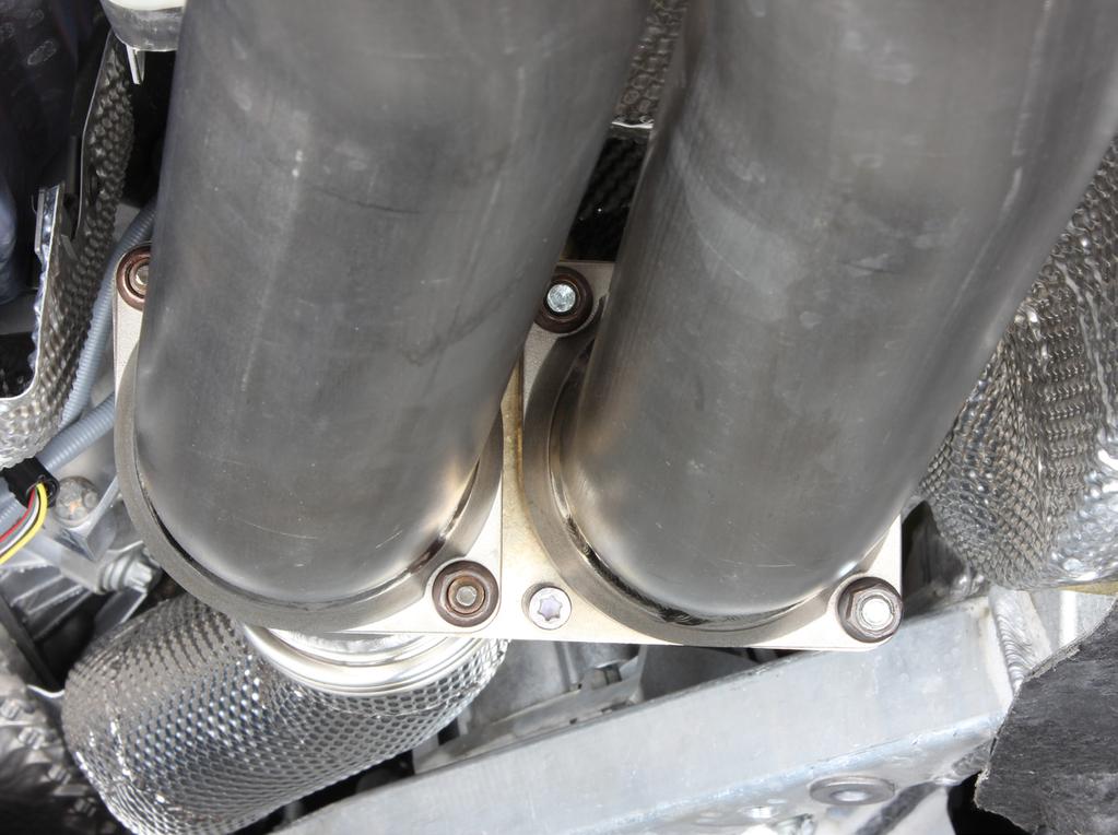 2. Install the Akrapovič link pipes onto the stock down pipes, using stock flange nuts (Figure 7).