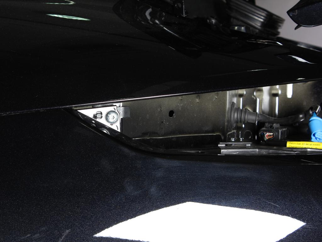 9. Unscrew the marked bolts on both sides of the vehicle and carefully remove the rear bumper off the
