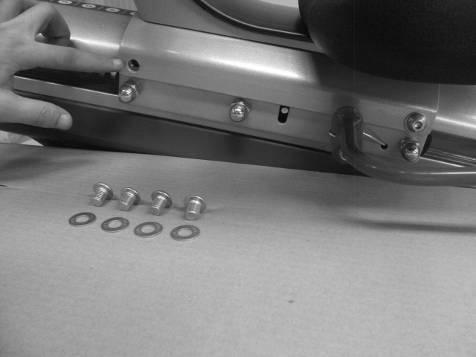 . 4. Install the Seat Assembly Carefully position the seat frame over the seat carriage on the bike frame, aligning the attachment holes in