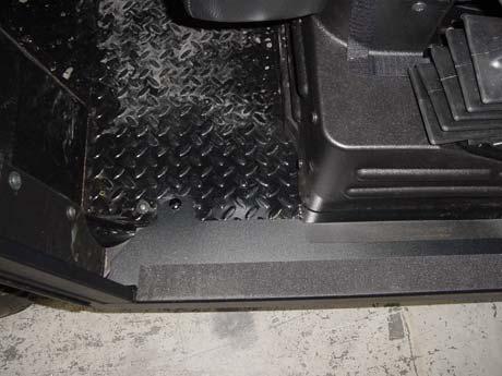Install the supplied nut covers. E. (Figure 14) Align edge of side frame floorboard with edge of plastic trim on vehicle floor.