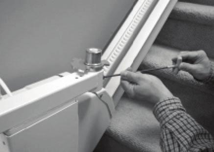 Adjust the seat base up or down relative to the footrest structure until the holes align, then replace and securely tighten the four (4) bolts.