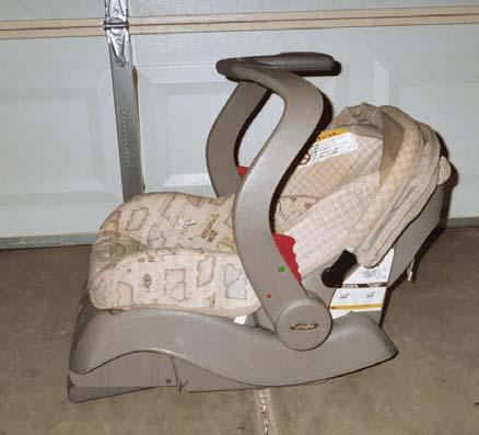 The infant seat was configured with a 5- point internal harness system and a two-piece locking harness retainer clip. The seat was designed with three shoulder harness positions.