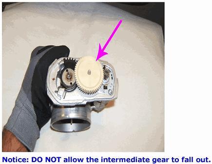 Grasp the TP sensor cover and carefully lift it straight up and separate it from the throttle body. 11.