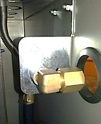 This adjustment will allow the side burner to drop into place. Figure 1.