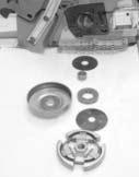 (Figure 1) Use a 19mm wrench to turn the clutch clockwise and remove. Slide the clutch cup/drive sprocket assembly off the shaft. Remove the needle bearing and inspect for heavy wear or damage.