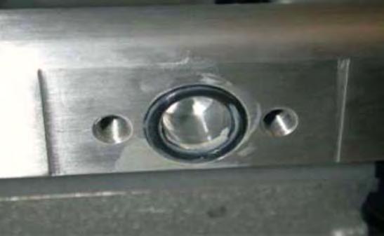 Apply a small amount of grease to the new supplied fuel manifold O-ring and set in the machined