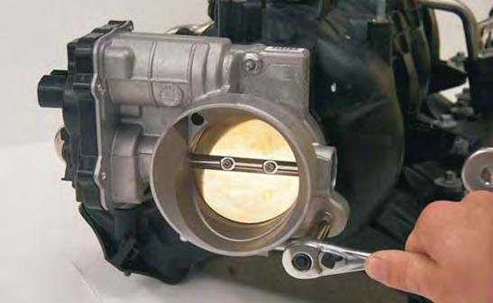 97. Using a 10mm socket wrench, remove the stock throttle