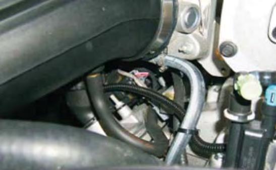 Attach the PCV hose from the right (passenger) side valve cover to the brass barb on the bottom of the air tube.