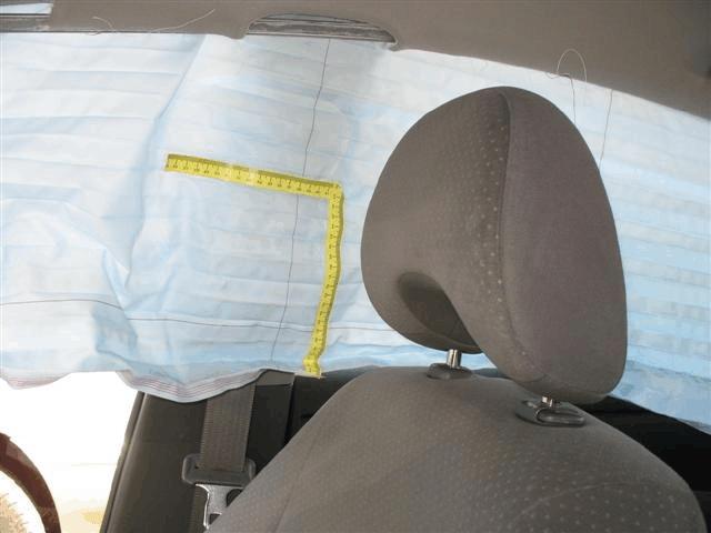 The left rear window glazing was disintegrated due to impact damage. Manual Restraints The Prius was configured with 3-point manual lap and shoulder belts for all five seating positions.