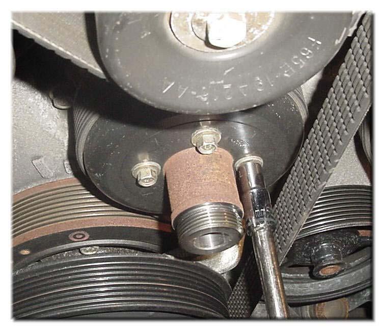 Page 12 of 30 23) Remove tension on the Water Pump Pulley by using a?? drive wrench (with a 6?