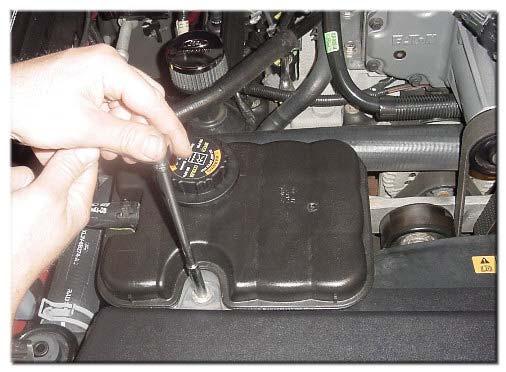 of your Lightning, disconnect the battery (8mm nut) 2) Remove Intercooler Coolant Reservoir Bolt (8mm) and