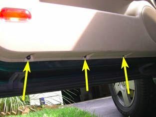 3 5. To take the main handle piece off of the driver's door panel, pull the rear of the handle upwards to unclip it. Do the same at the front edge of the handle.