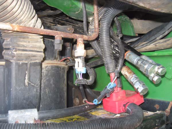 Hose Connection Procedure 2. Route the hoses out under the exhaust below the front, right side of the cab shown in Figure 2-33.