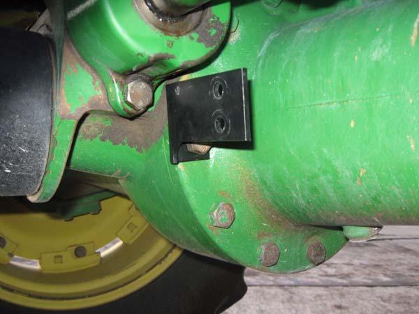 Attach the Wheel Angle Sensor bracket as shown with the existing bolt.