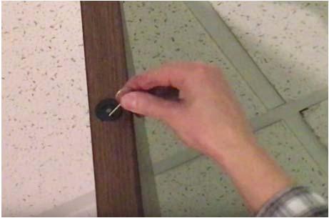 from the door using the extractor (see Figure 5) to hook into