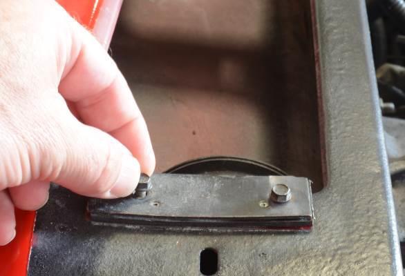 The two outer most fasteners holding the cowl panel are held into the stock hood hinges with clips (Figure 2).