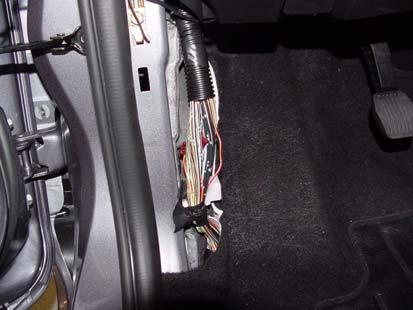 8 Connect EC Mirror Harness to Vehicle Power 1) Locate wire bundle in driver side kick plate location and remove electrical tape wrapping as required. (Fig.