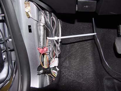 5) Bundle excess EC harness wire in driver side in driver side footwell and secure to OEM harness with tie wrap. (Fig. 9-5) a) Snip off excess cable tie.