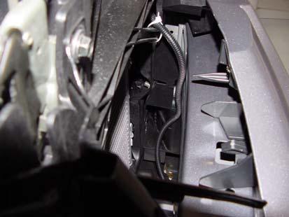 4) Route temperature harness along bottom of facia and secure to front mounting bracket at driver-side of vehicle, with tie wrap. (Fig.