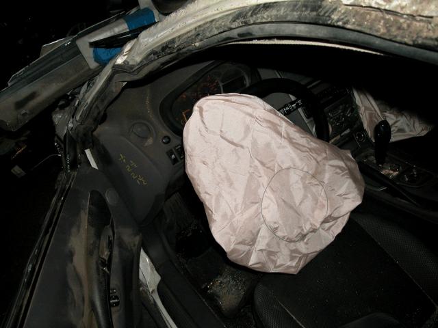 FRONTAL AIR BAG SYSTEM - 2000 Toyota Celica The 2000 Toyota Celica was equipped with dual front air bags. The air bags deployed as a result of the first impact with the guardrail.