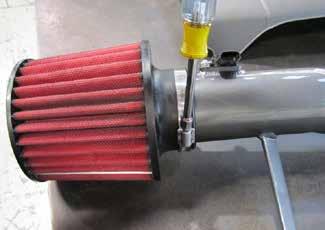 Slide the AEM air filter over the inlet end of the intake pipe and fasten with the