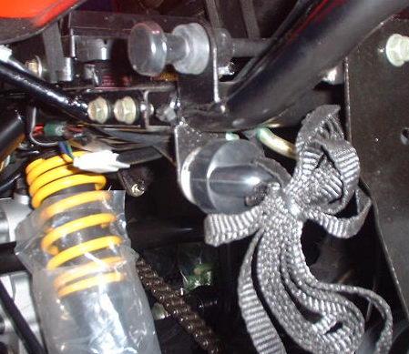 OPERATION SAFETY SWITCH (50CC ONLY) This switch is located on rear left side of the chassis. This switch is equipped with a cap and rope.