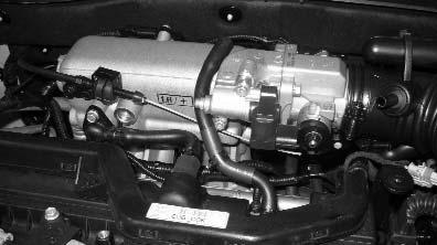 INSTALLATION STEP 5: THROTTLE ATTACHMENT LOCATION: ENGINE THROTTLE SHAFT AREA FACTORY CABLE BRACKET 1.
