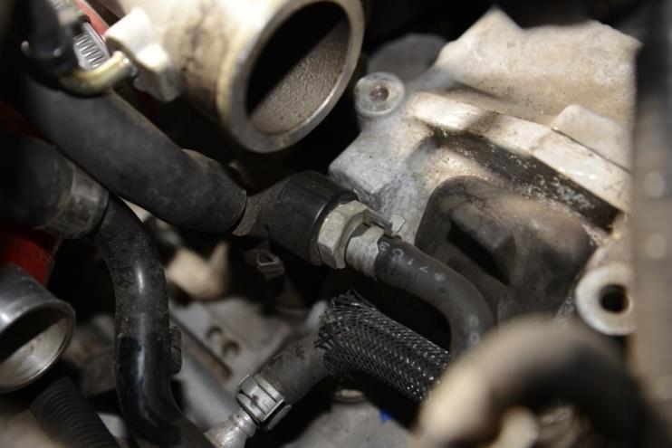Disconnect the water lines and electrical plugs and set the throttle body aside.
