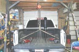 To install the ½ suction tube it is necessary to either drop the fuel tank or to lift the truck bed.