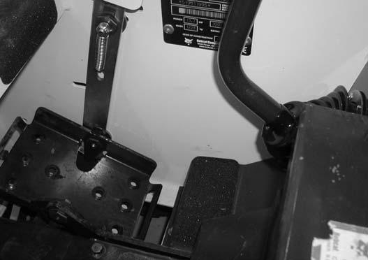 The seat bar in the down position helps to keep the operator in the seat. 2 The foot pedals have mechanical interlocks for the lift and tilt functions.