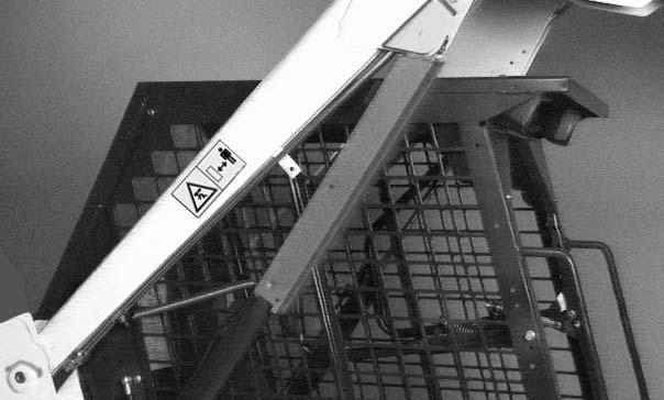 Raise the lift arms until the lift arm support device drops onto the lift cylinder rod (Item ) [Figure 9].