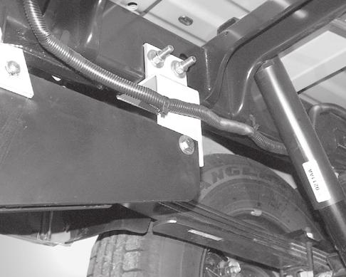Position front bracket outside of subframe and under frame rail. Install a 1/2"-13 x 1-1/2" cap screw with 1/2" flat washer from the inside of the subframe and secure with a 1/2"-13 locknut.