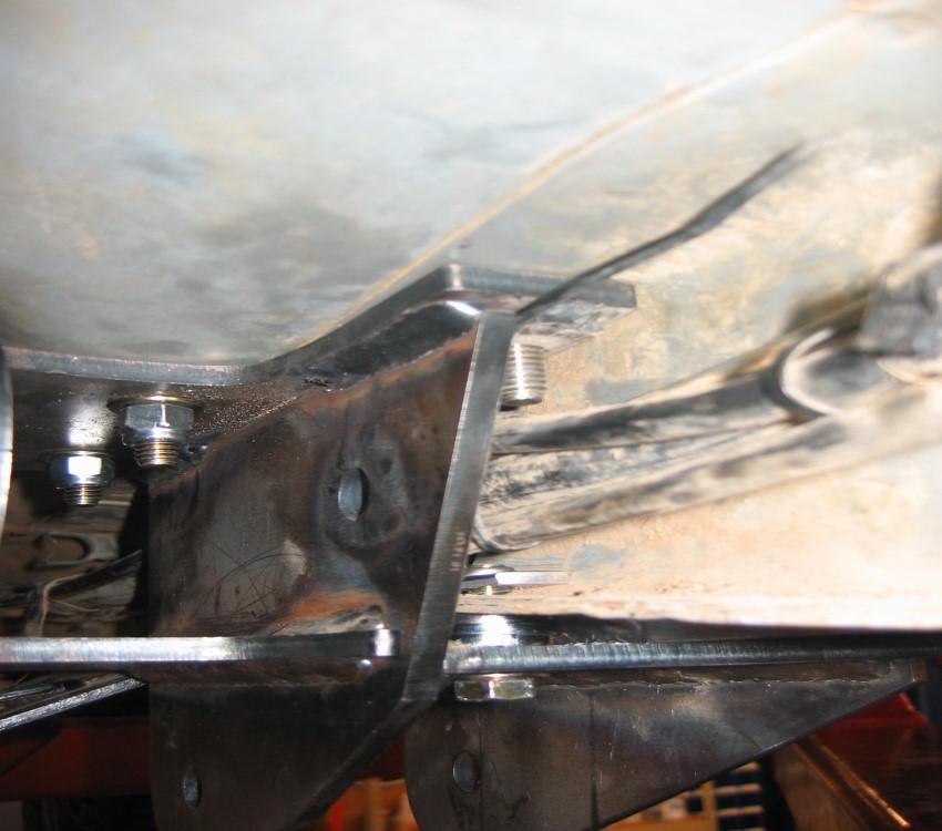 Install the 9/16 x 4" bolts with SAE washers and weld nuts. Start the bolts and nuts, but do not tighten now. 24. With the control arms in place, the eight 3/8" x 1.