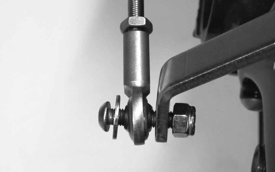 If it is not, loosen the set screw in the top of the quad lever with a 1/8" Allen wrench and slide the quad lever off of the shaft.